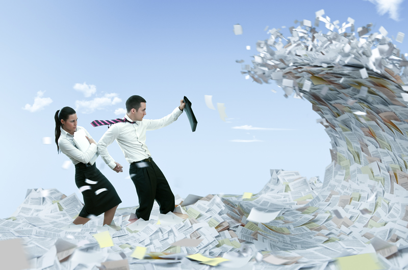 Man and woman in white shirt block themselves from a wave of documents