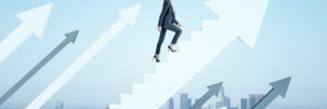 A woman in a business suit walking up the "corporate ladder"