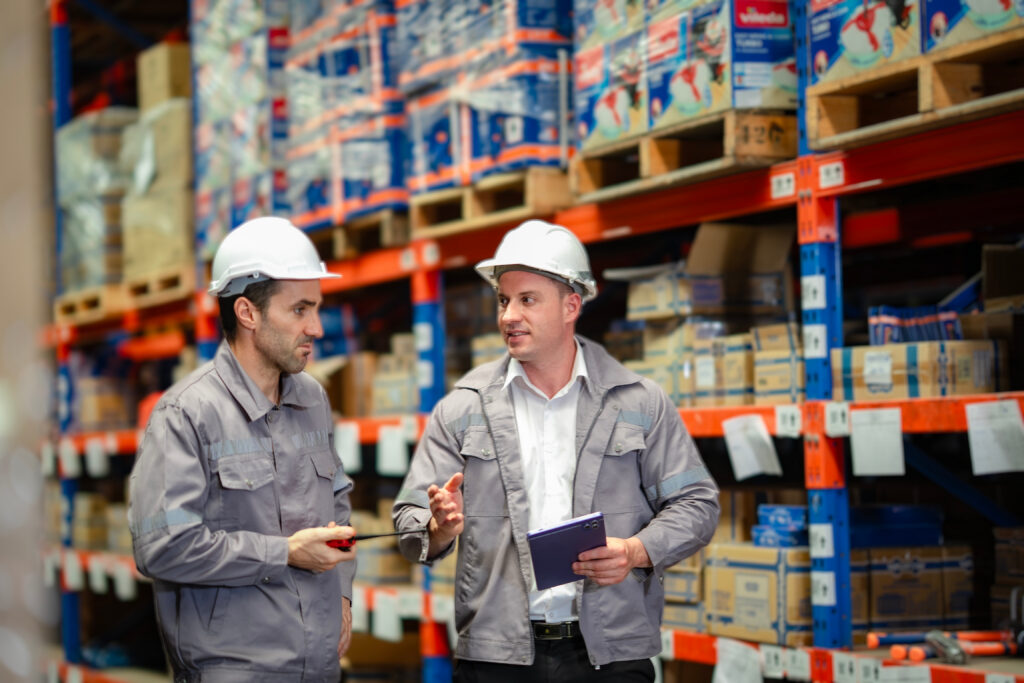 two men in a warehouse