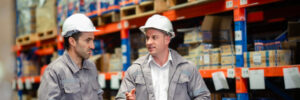 two men in a warehouse